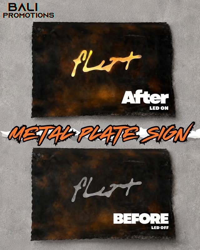 Papan nama metal plate sign bali bergaya industrial dengan cahaya lampu LED kuning hangat di dinding semen ekspos cafe.